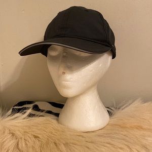 Lululemon Unisex black cap with small zip pocket on the side